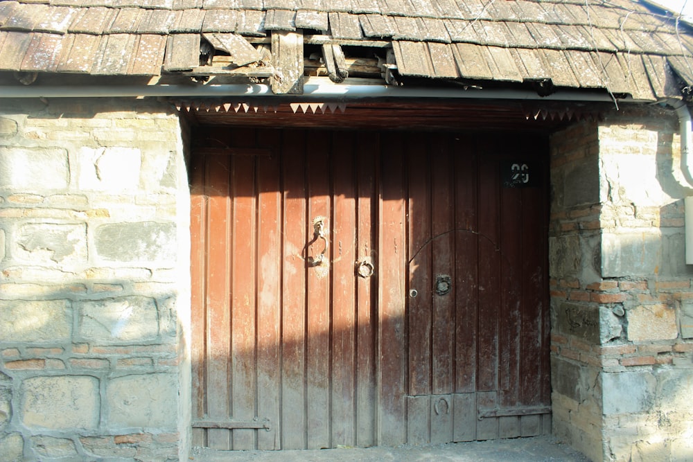 an old stone building with a wooden door