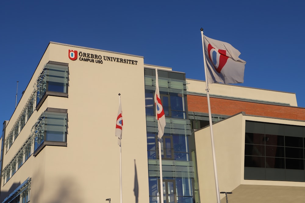 a building with flags flying outside of it