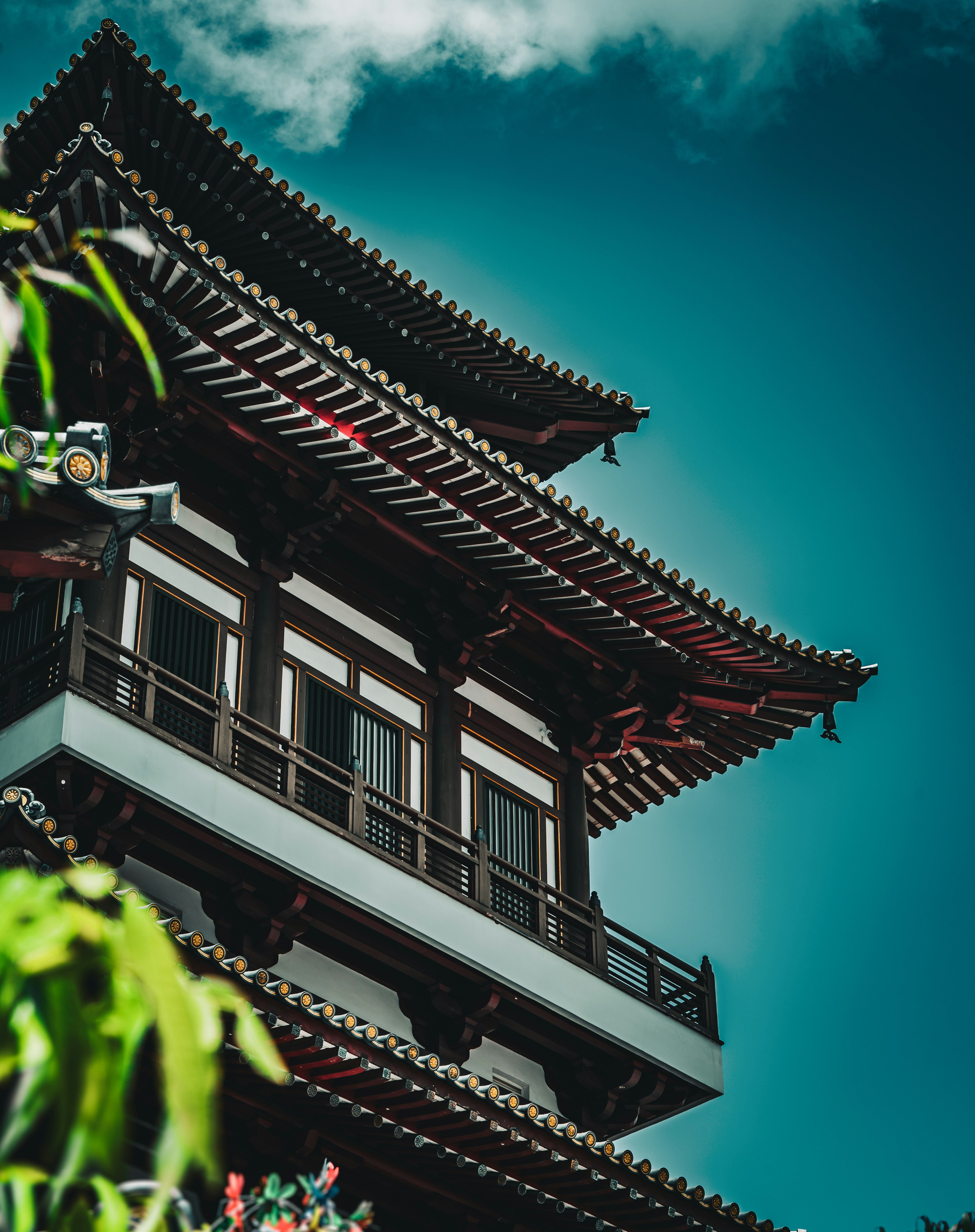 a tall building sitting under a blue sky