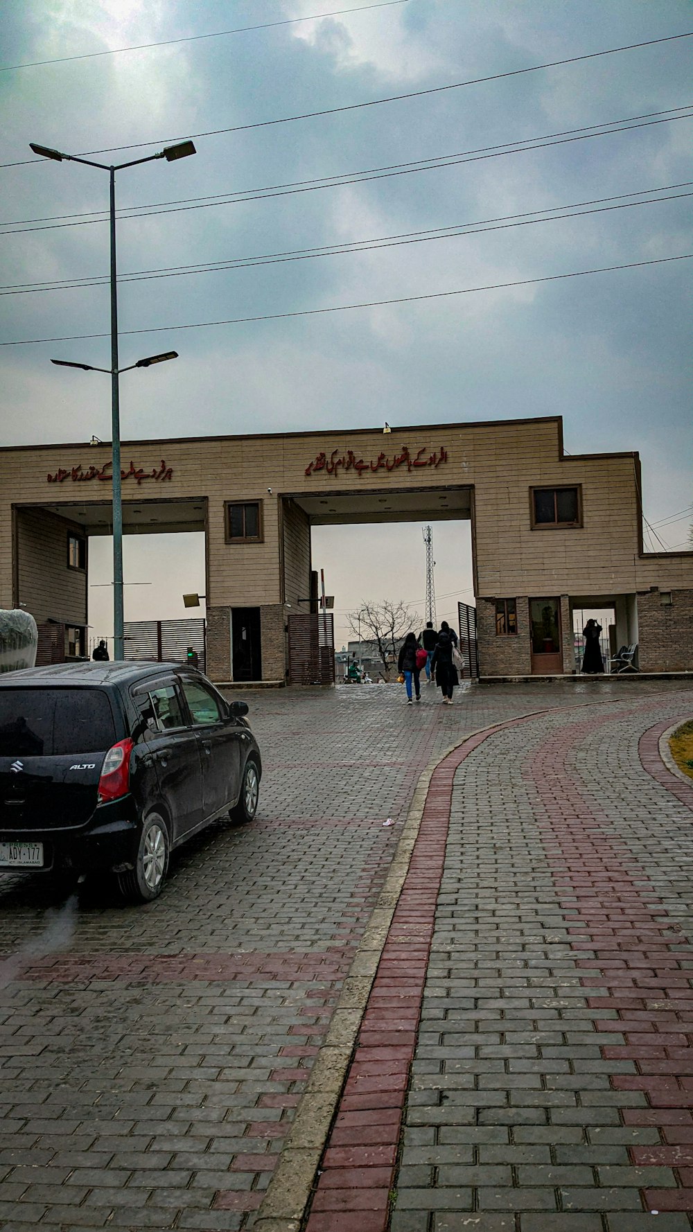 a black car parked in front of a building