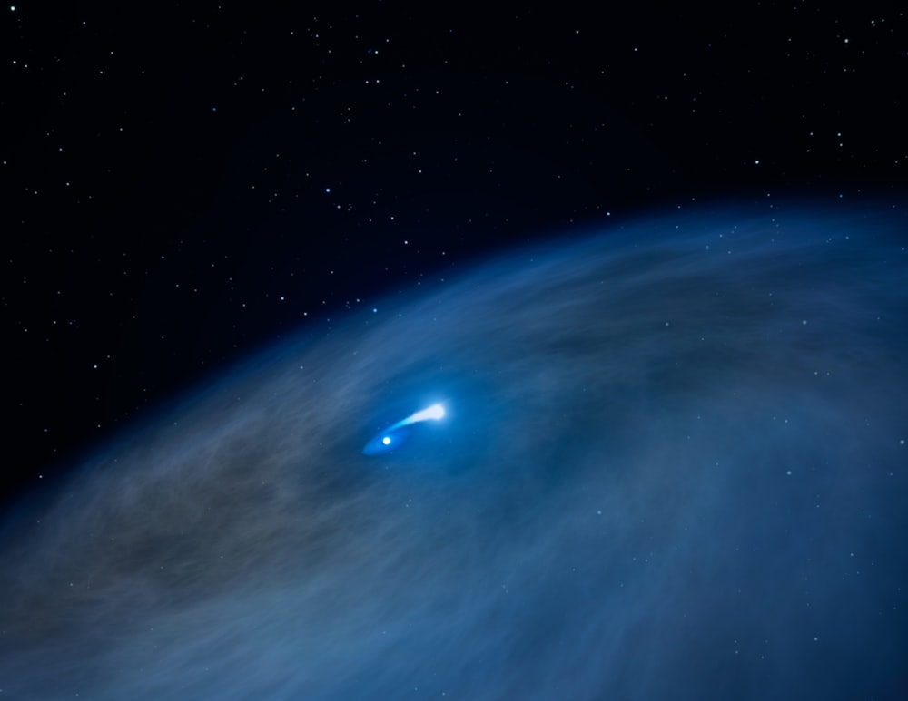 a large blue object in the middle of the night sky
