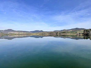 a large body of water surrounded by mountains