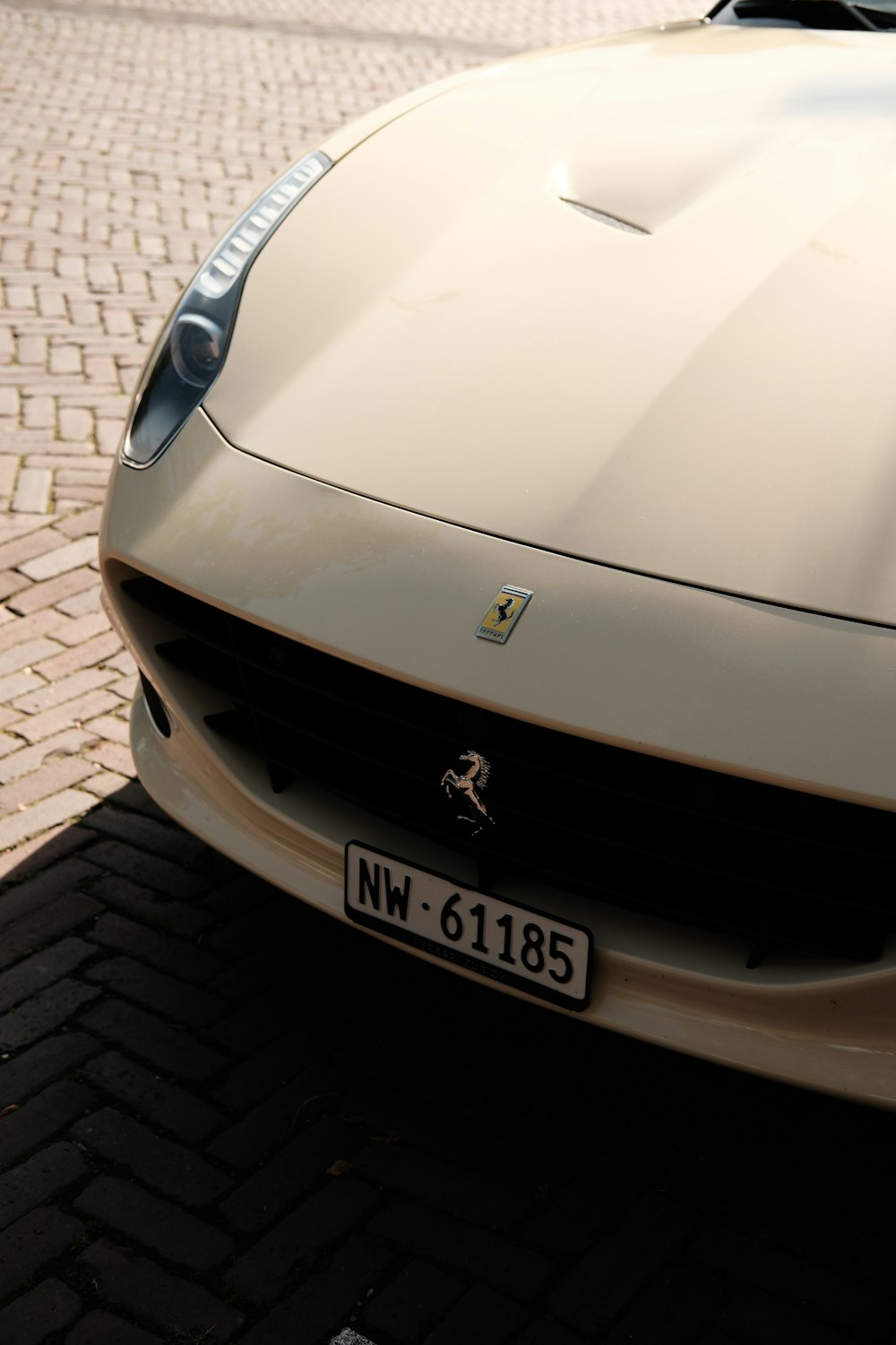 a white sports car parked on the side of the road