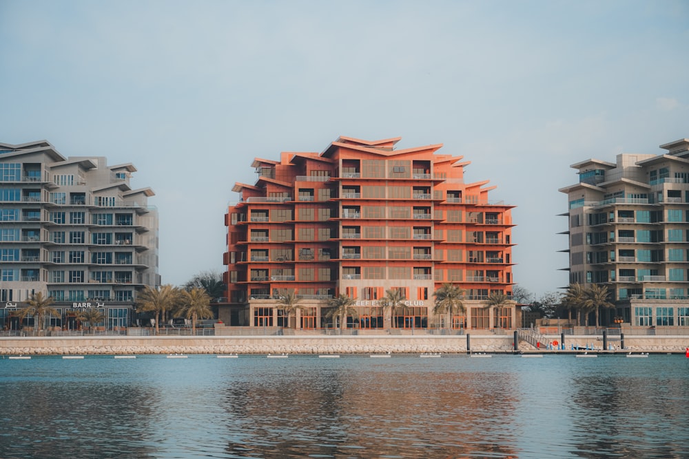 a body of water with a building in the background