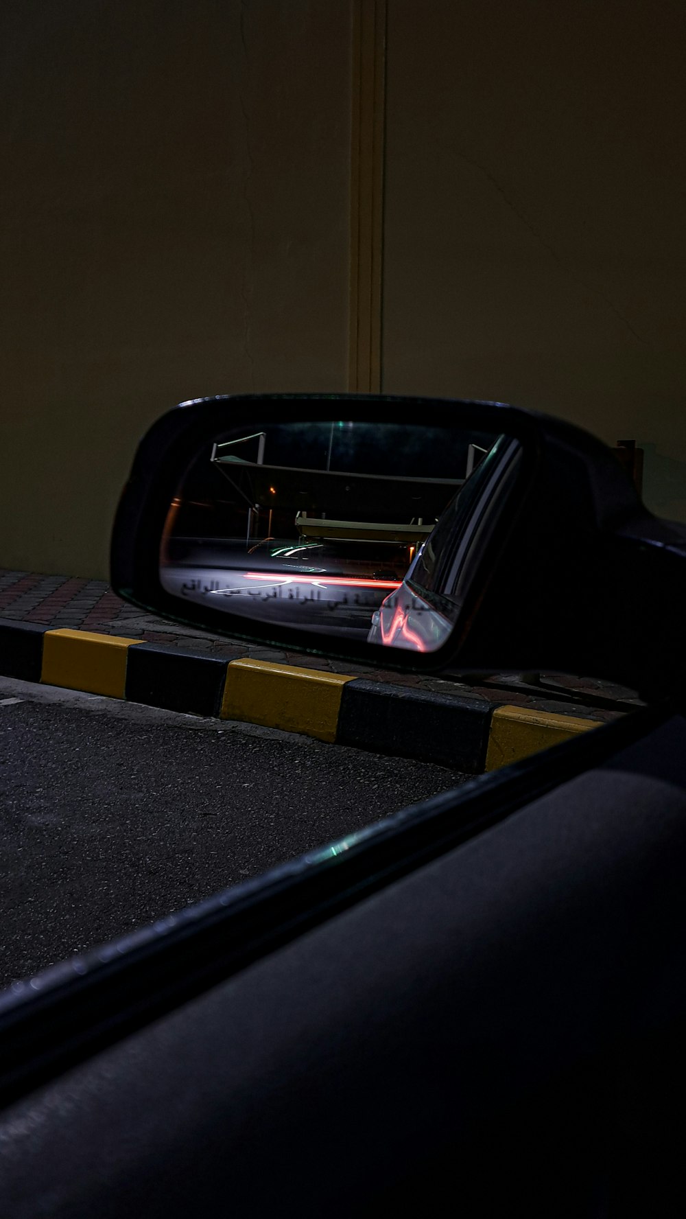 a rear view mirror sitting on the side of a road