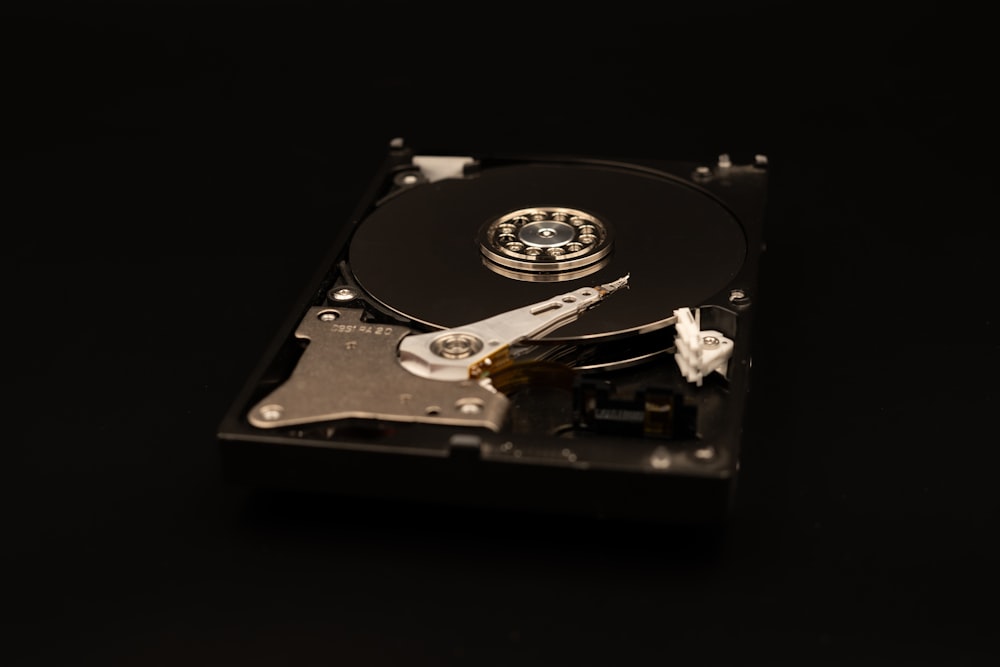 a close up of a hard drive on a black surface