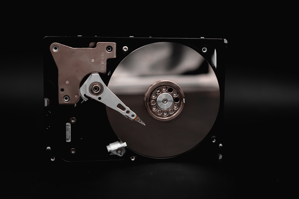 a close up of a hard drive on a black background