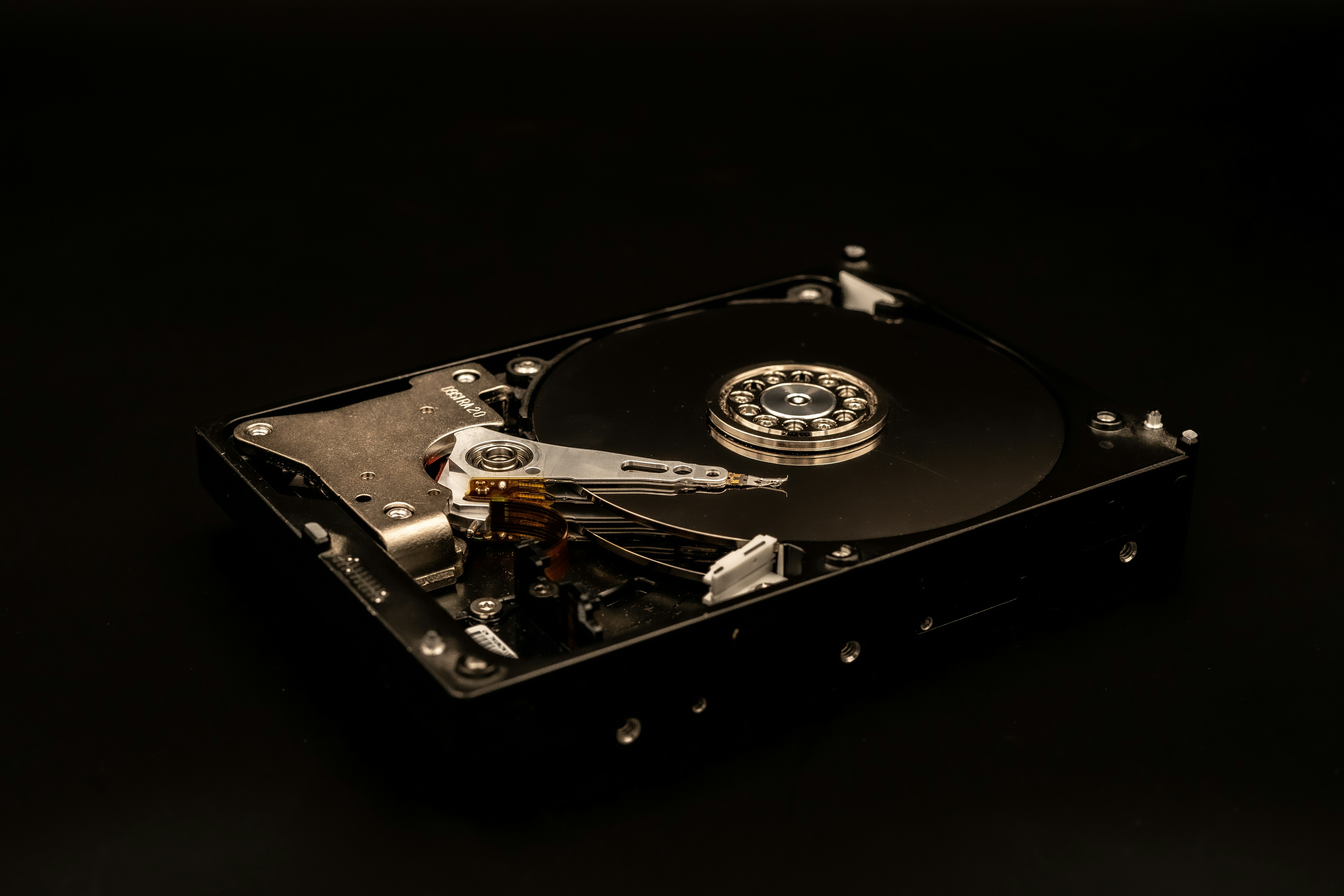 a close up of a hard drive on a black surface