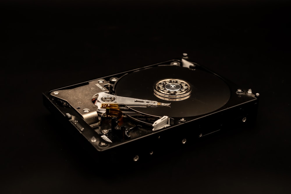 a close up of a hard drive on a black surface