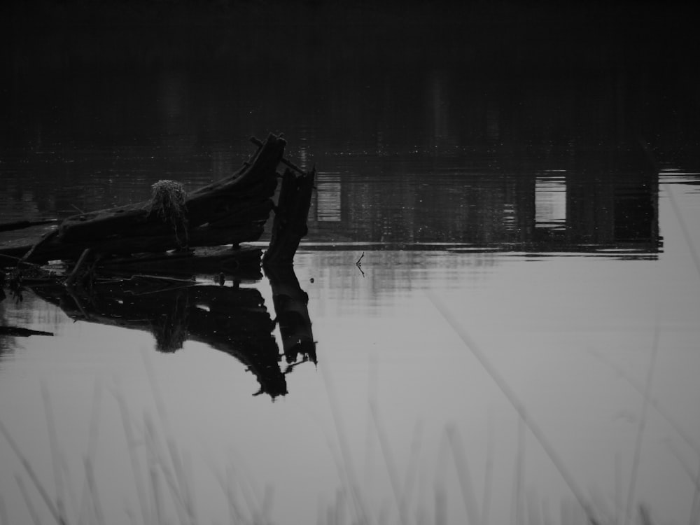 a black and white photo of a boat in the water