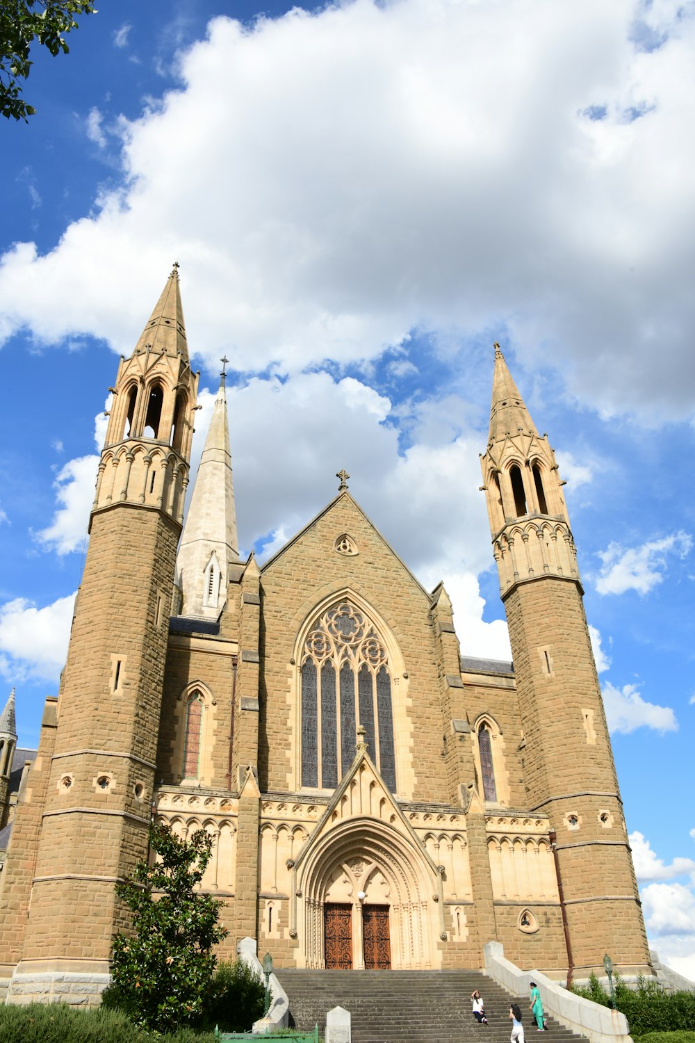 a large church with a steeple and two towers