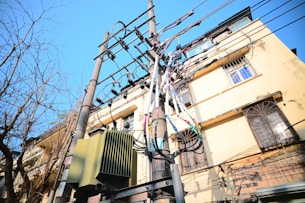 a telephone pole with many wires attached to it