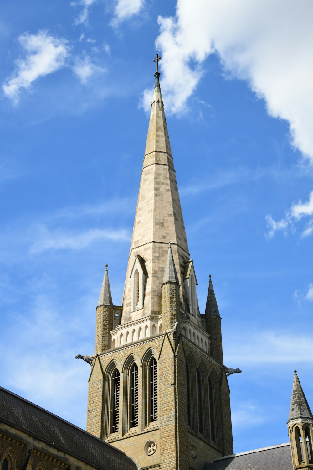 a church steeple with a blue sky in the background