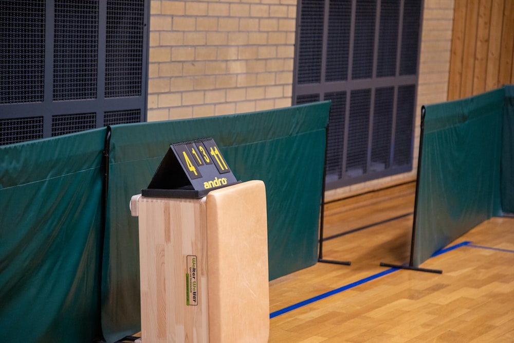 a wooden podium sitting on top of a hard wood floor