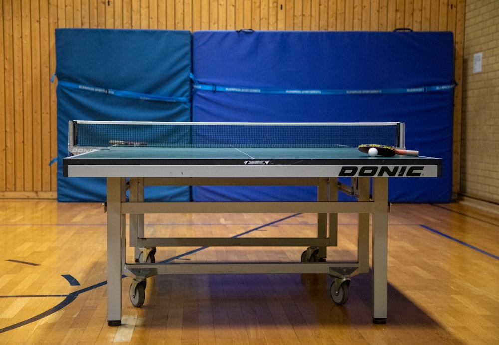 a ping pong table with a ping pong paddle on it