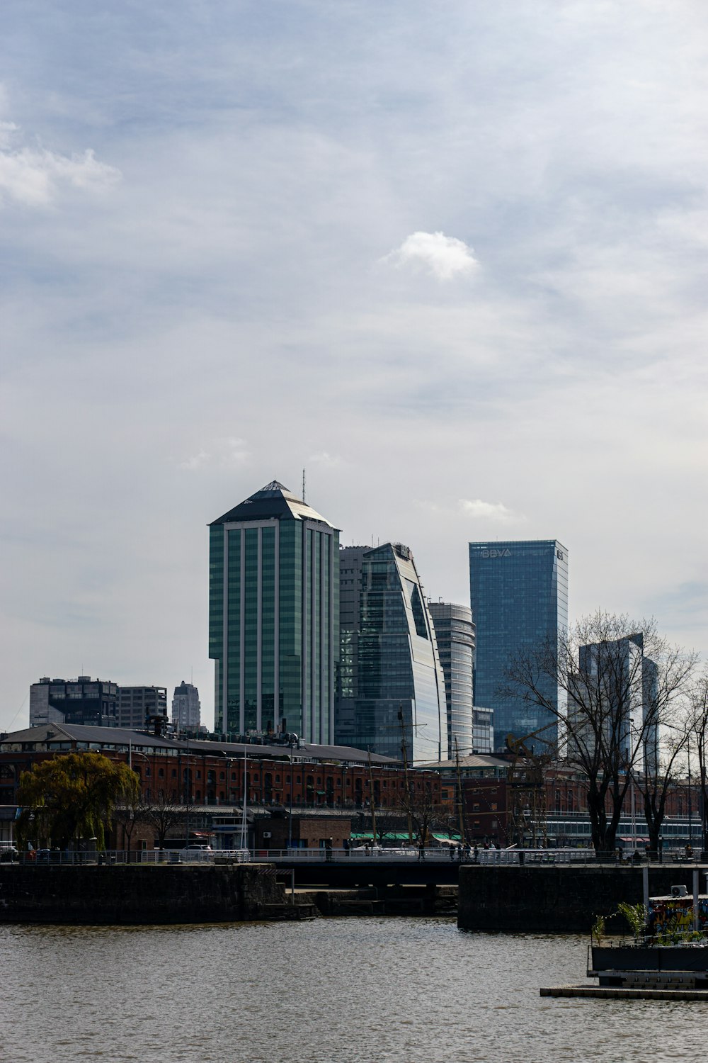 a body of water with a city in the background