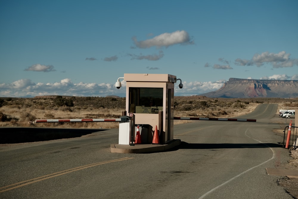 a small bus stop on the side of a road