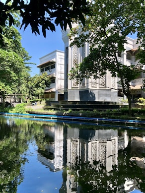 a large building sitting next to a body of water