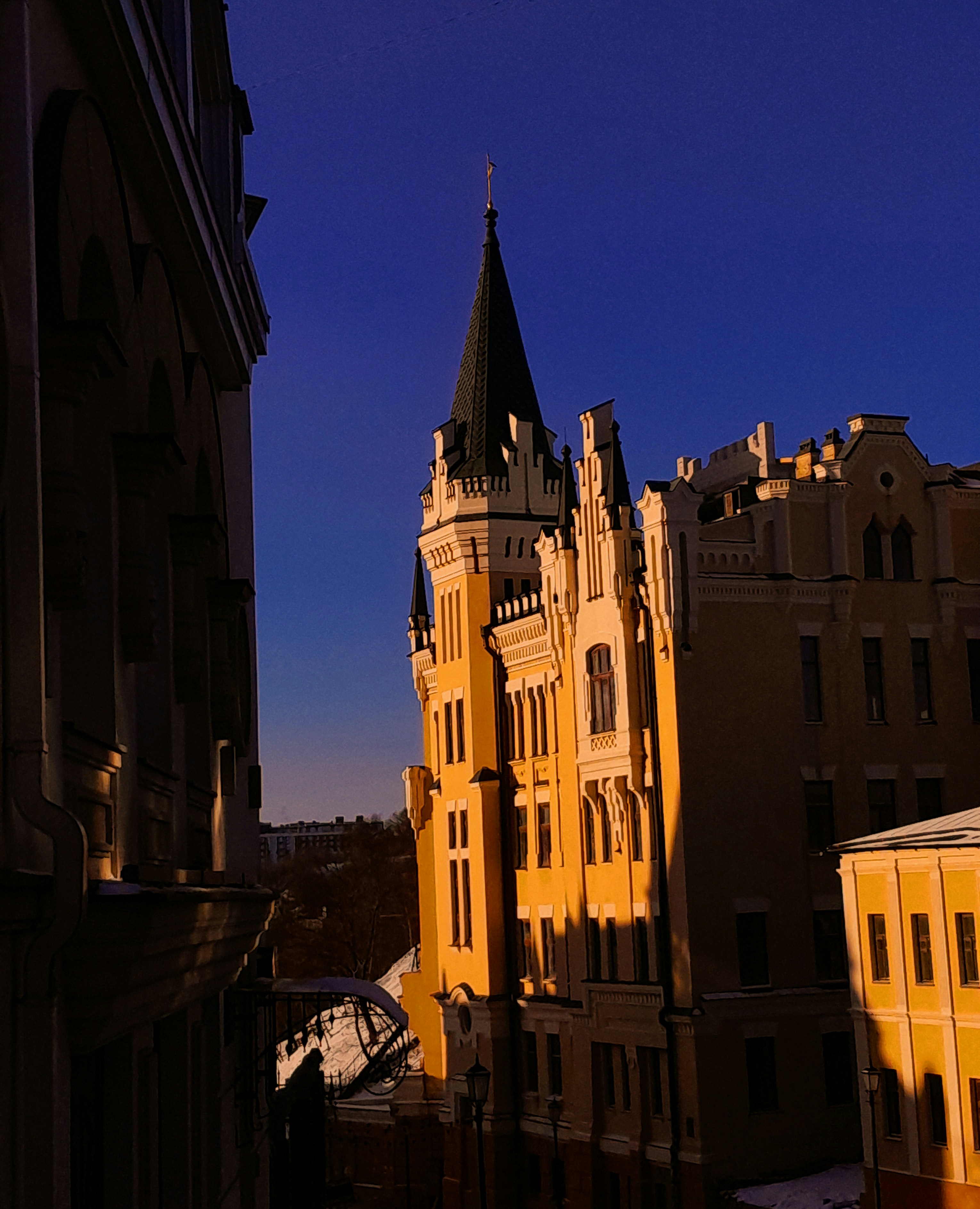 A tall building with a clock on the top of it photo – Free Sun Image on ...