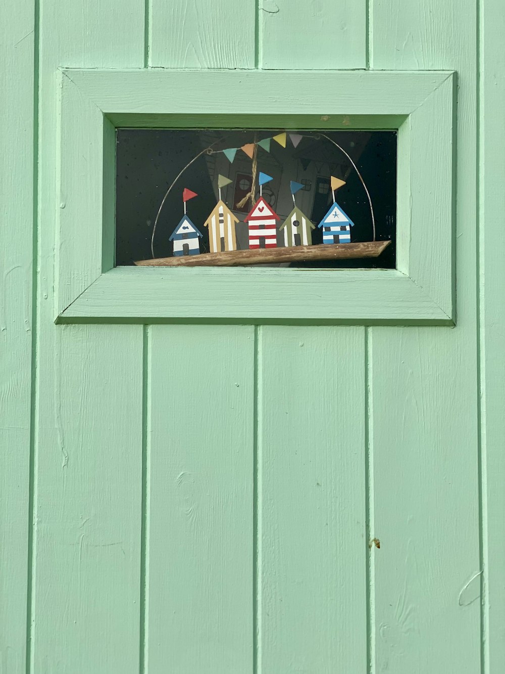 a picture of some houses in a window