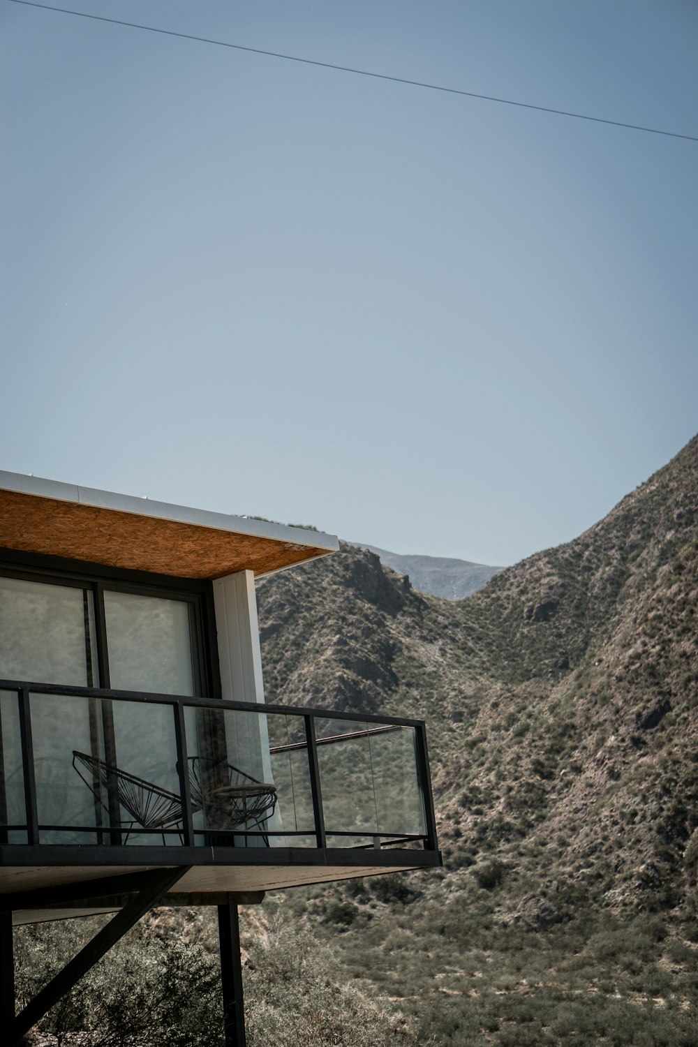 a balcony with a chair on top of it