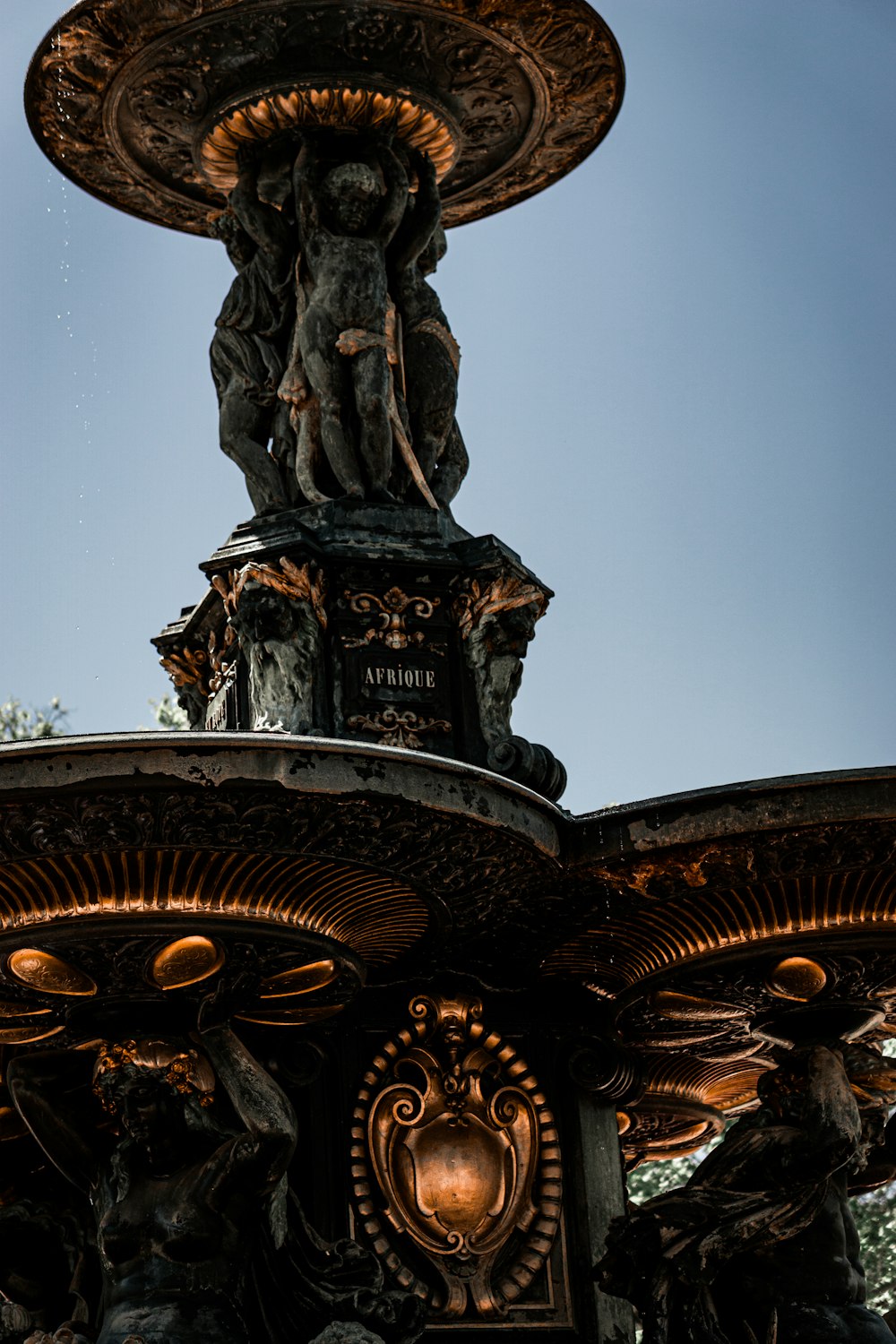 a fountain with a statue on top of it