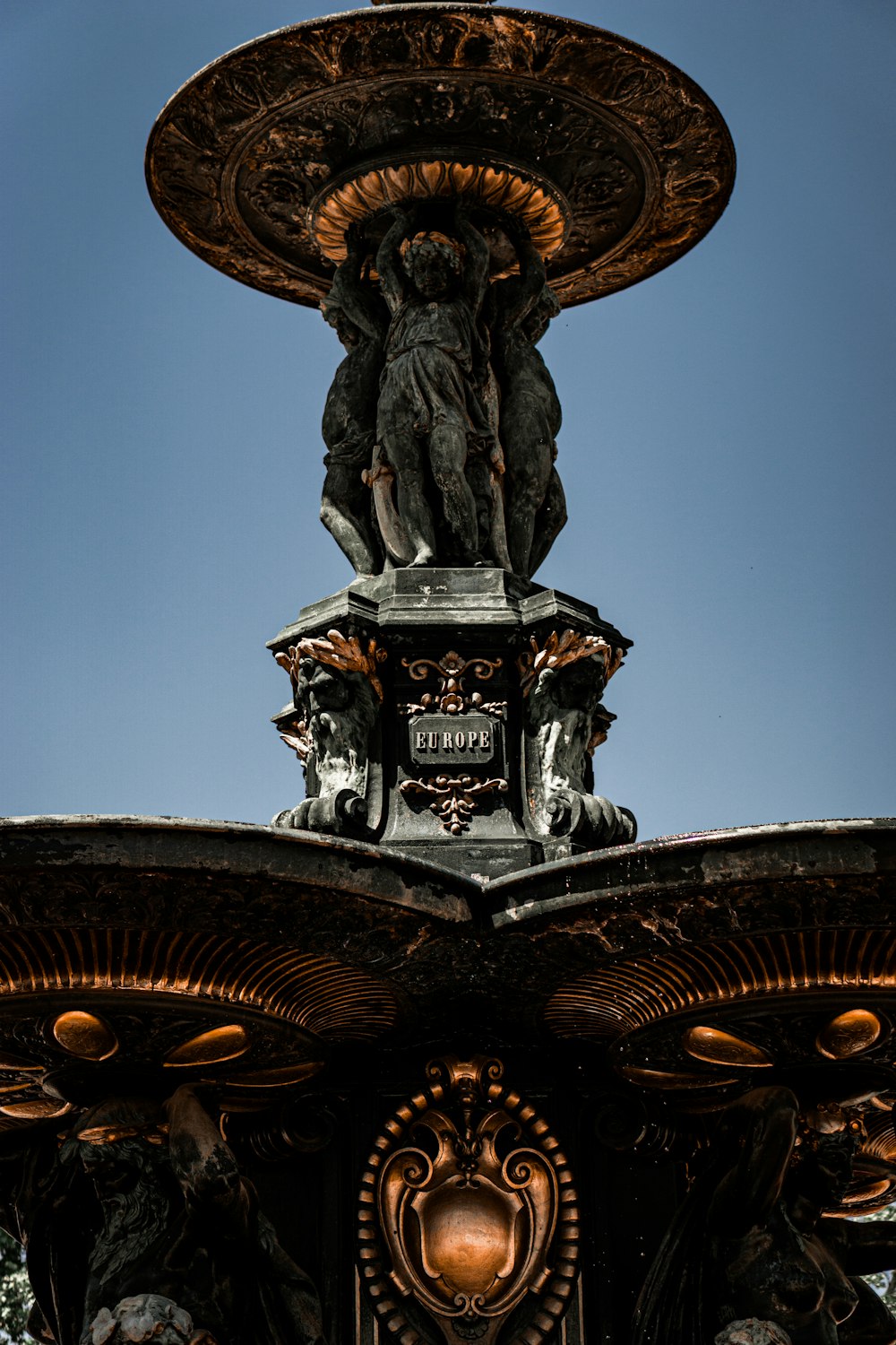 a fountain with a statue on top of it