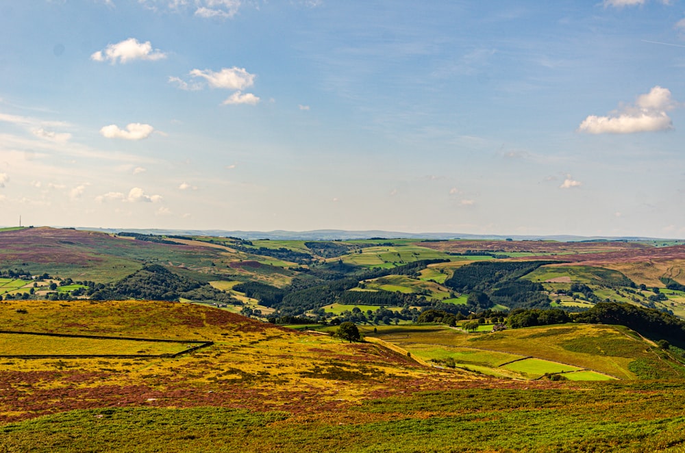 a scenic view of rolling hills and fields