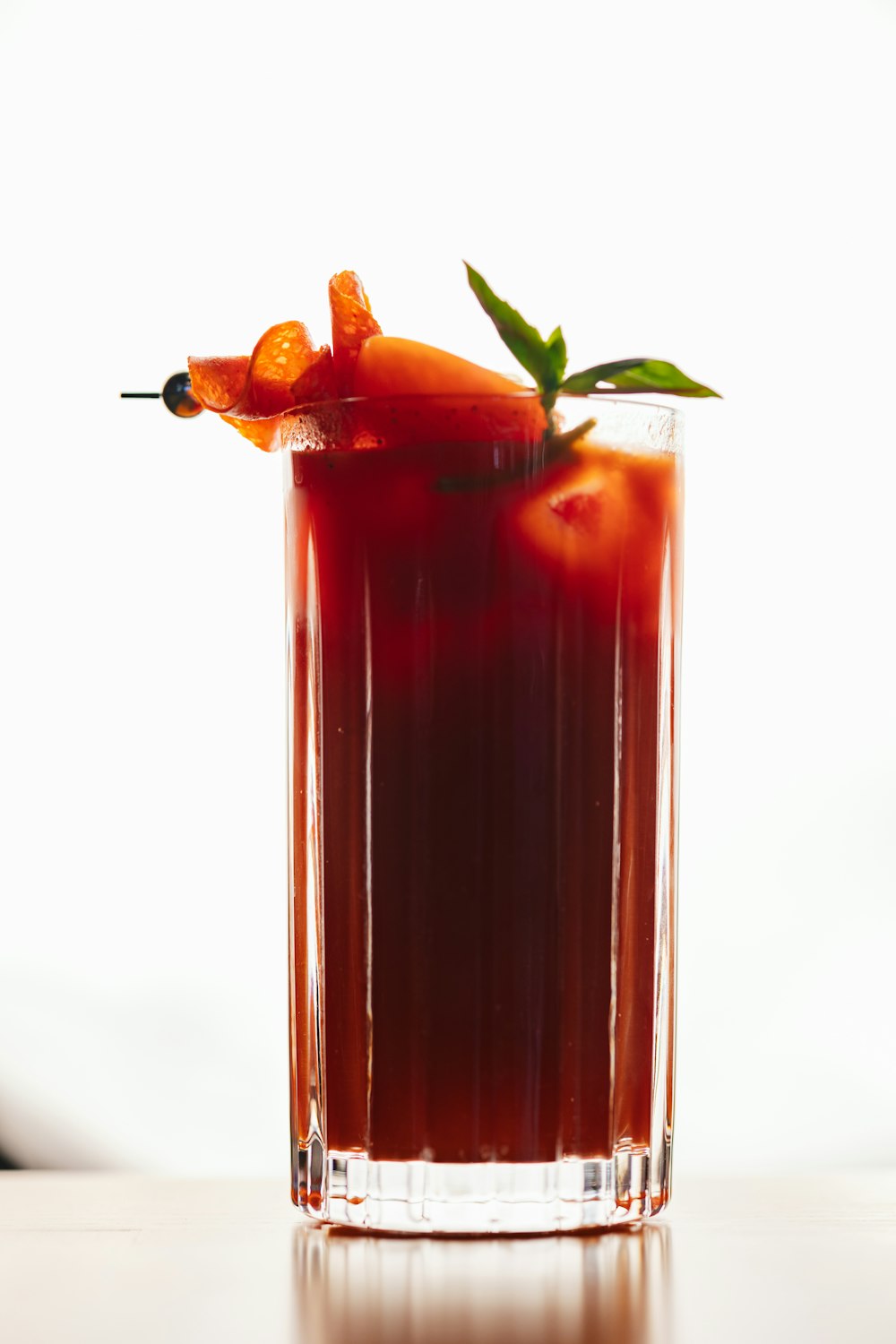 a bloody drink with a garnish garnish garnish garn