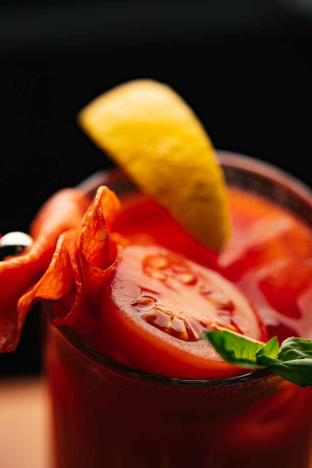 a close up of a drink with a slice of lemon