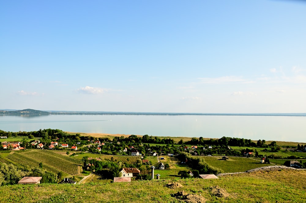 a scenic view of a small village by the water