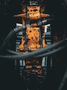 a close up of a metal object with a hose