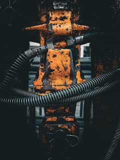 a close up of a metal object with a hose