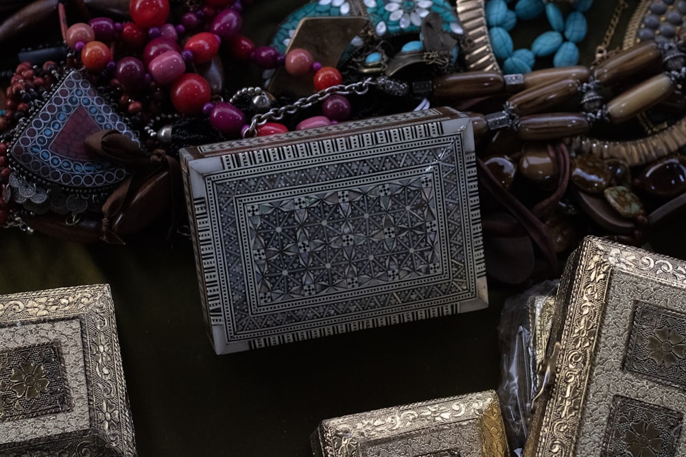 a table topped with lots of different types of jewelry