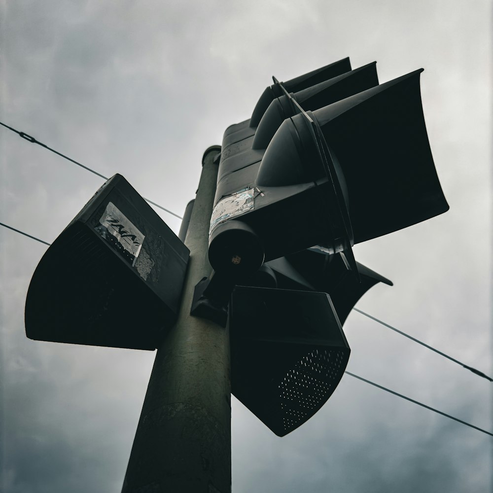 a traffic light sitting on top of a metal pole