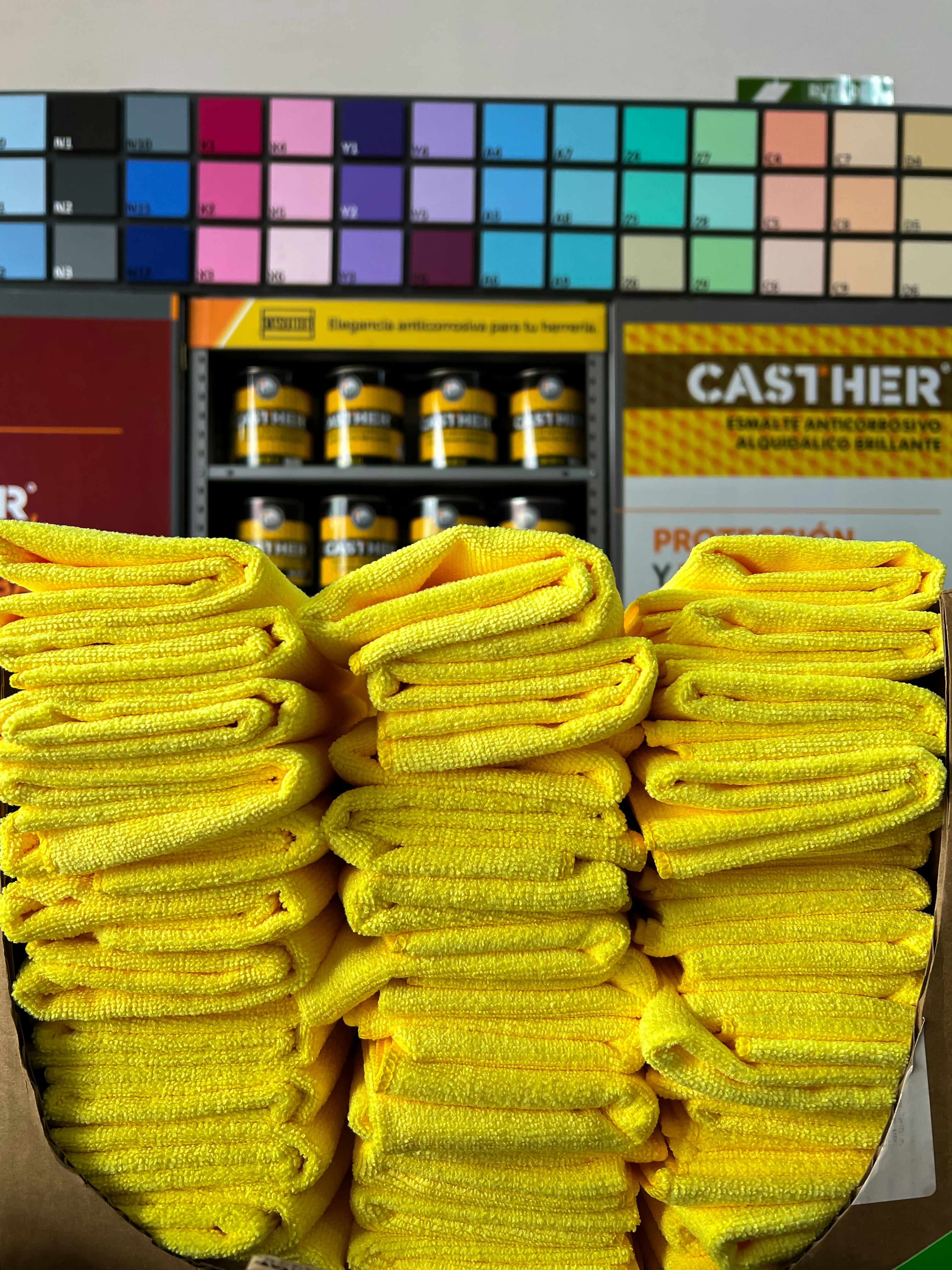 Stack of colorful microfibre cleaning cloths, bright product photography, white background