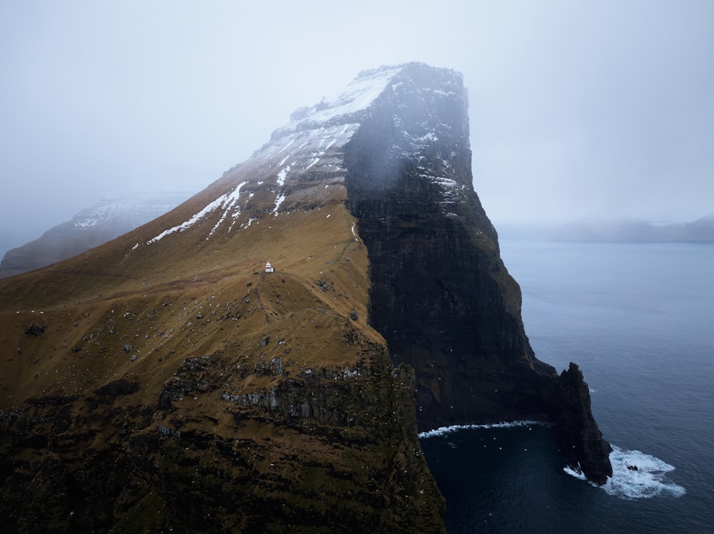 a very tall mountain with a very steep side