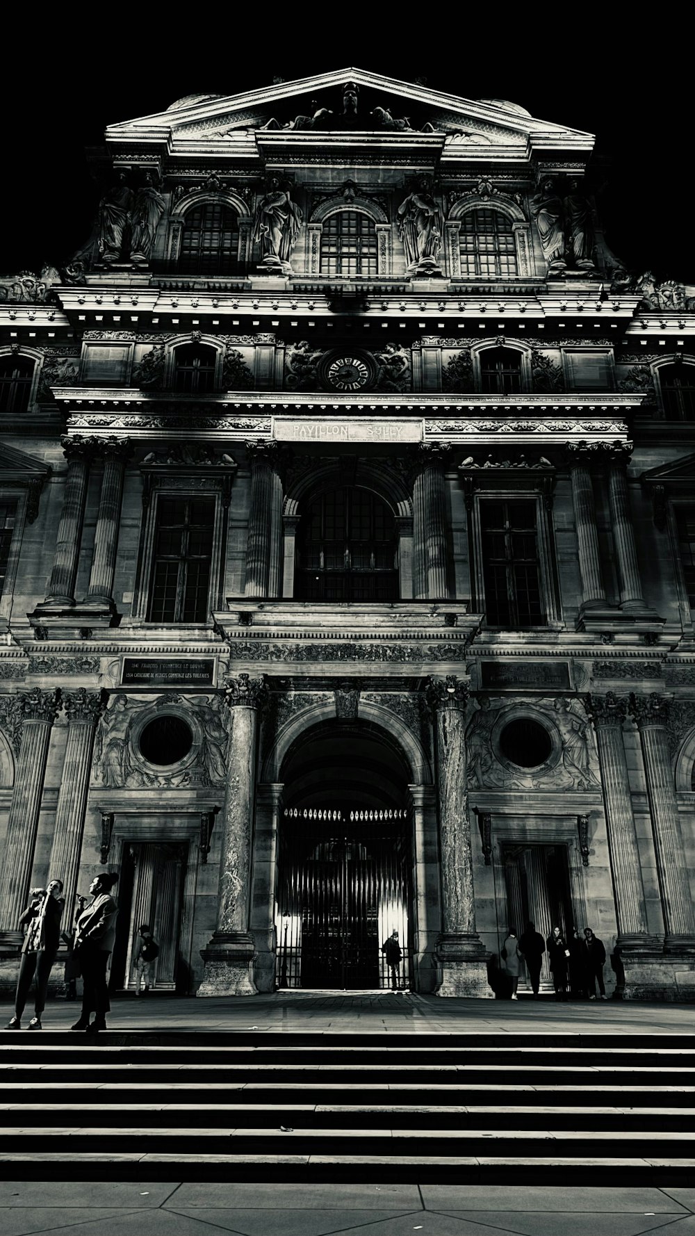 a black and white photo of a large building