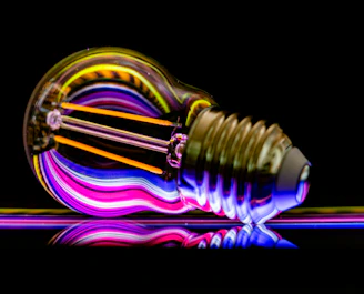 a colorful light bulb sitting on top of a table