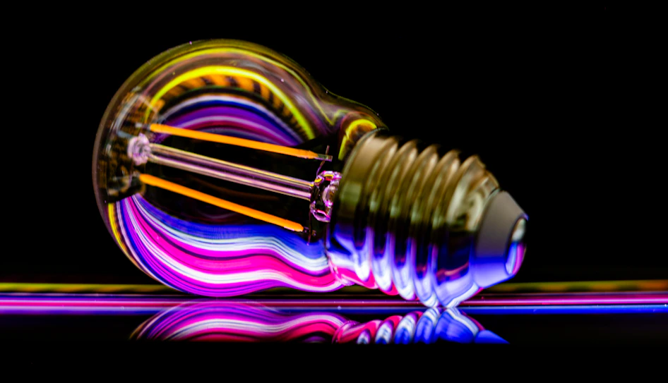 a colorful light bulb sitting on top of a table