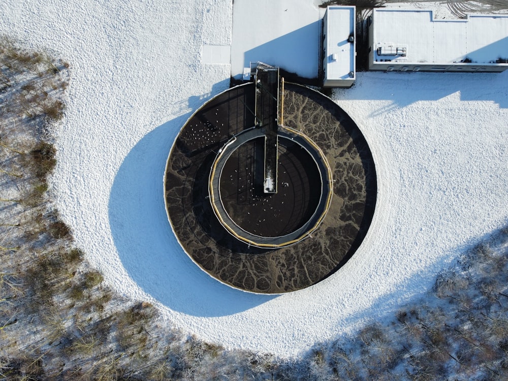 an aerial view of a clock in the snow