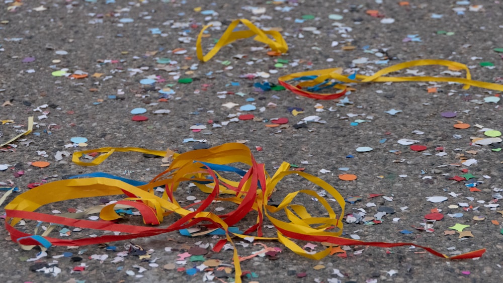 a bunch of confetti and streamers on the ground