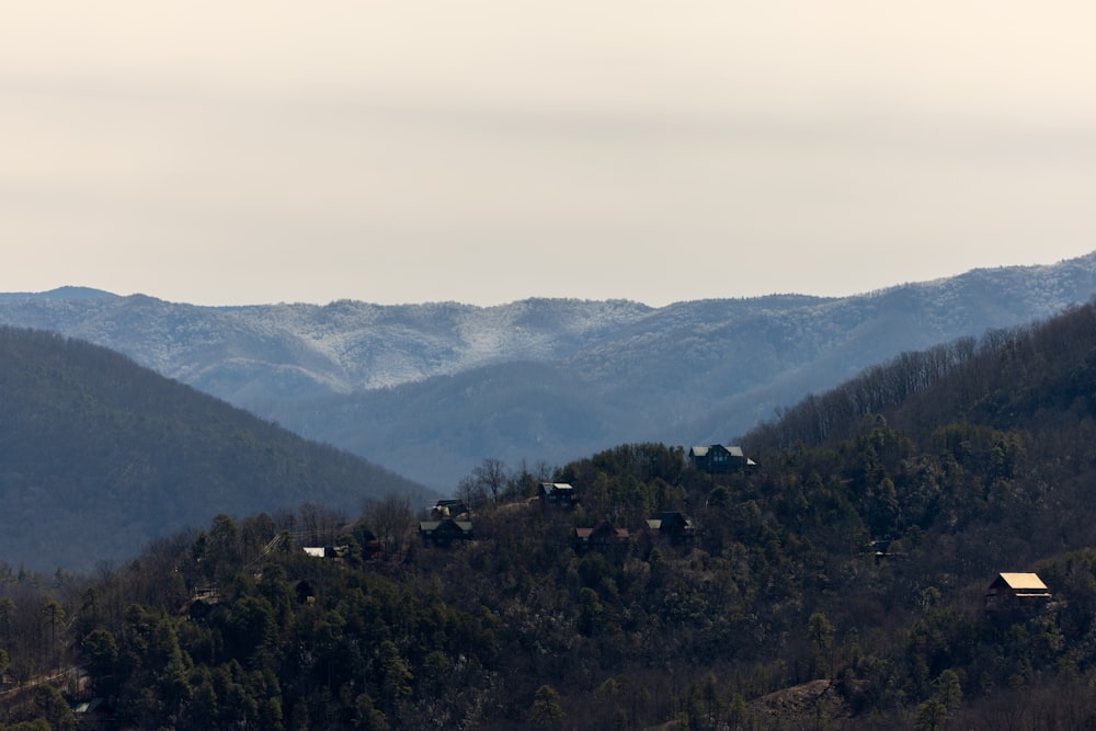 a view of a mountain range with houses on it