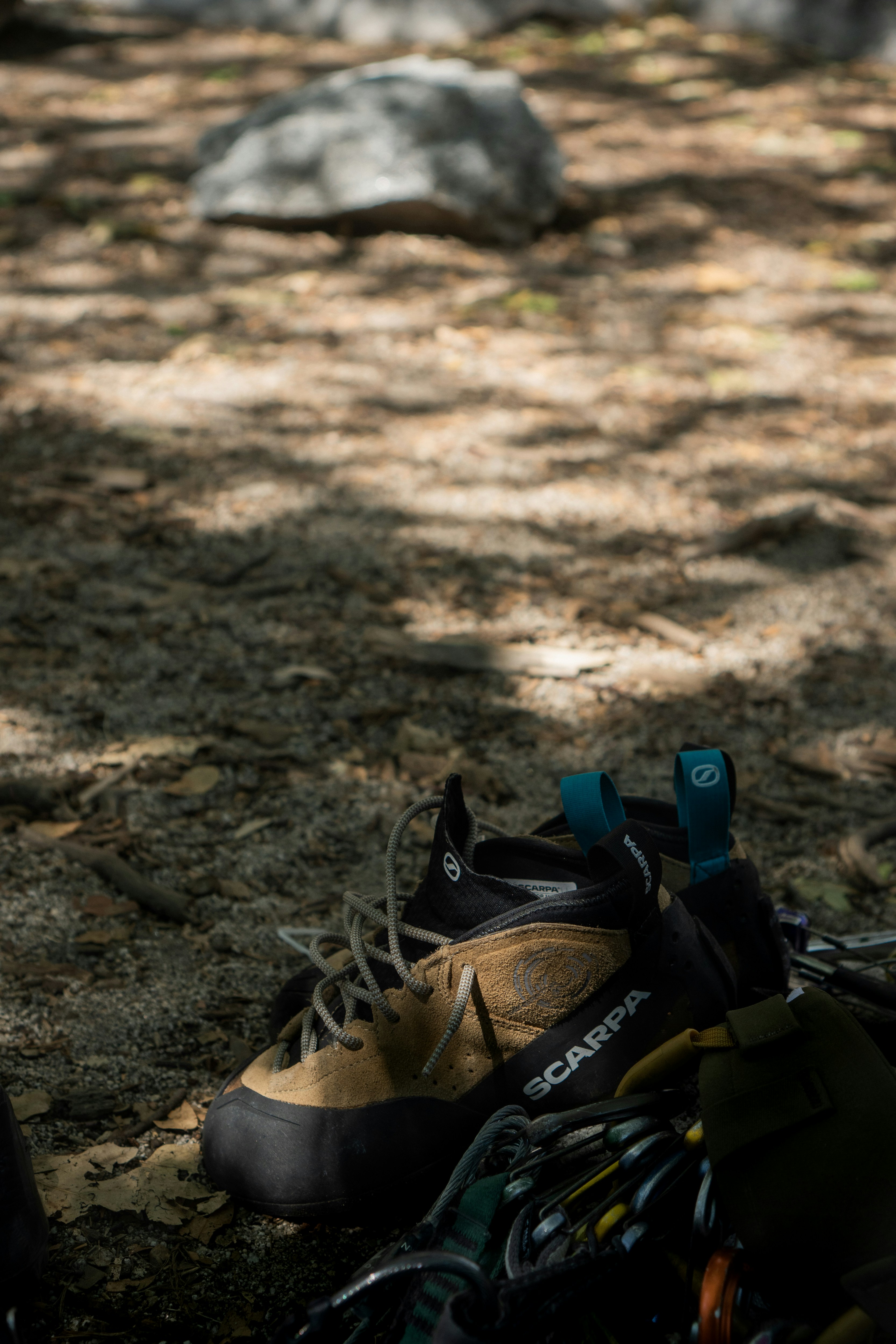 a pair of hiking shoes sitting on the ground
