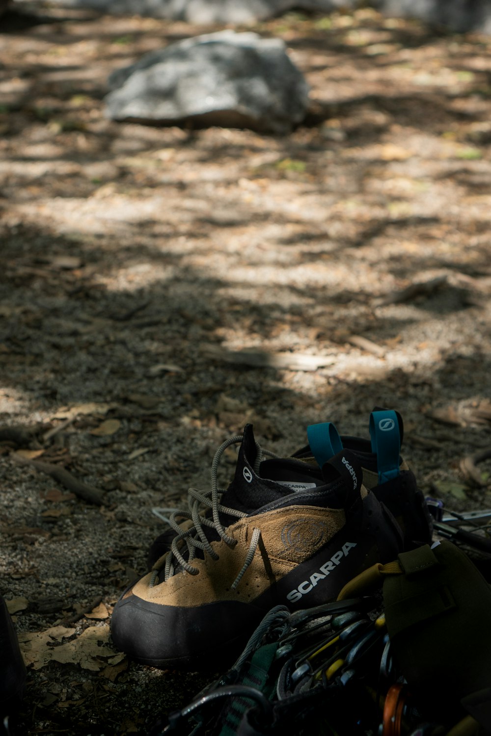 a pair of hiking shoes sitting on the ground