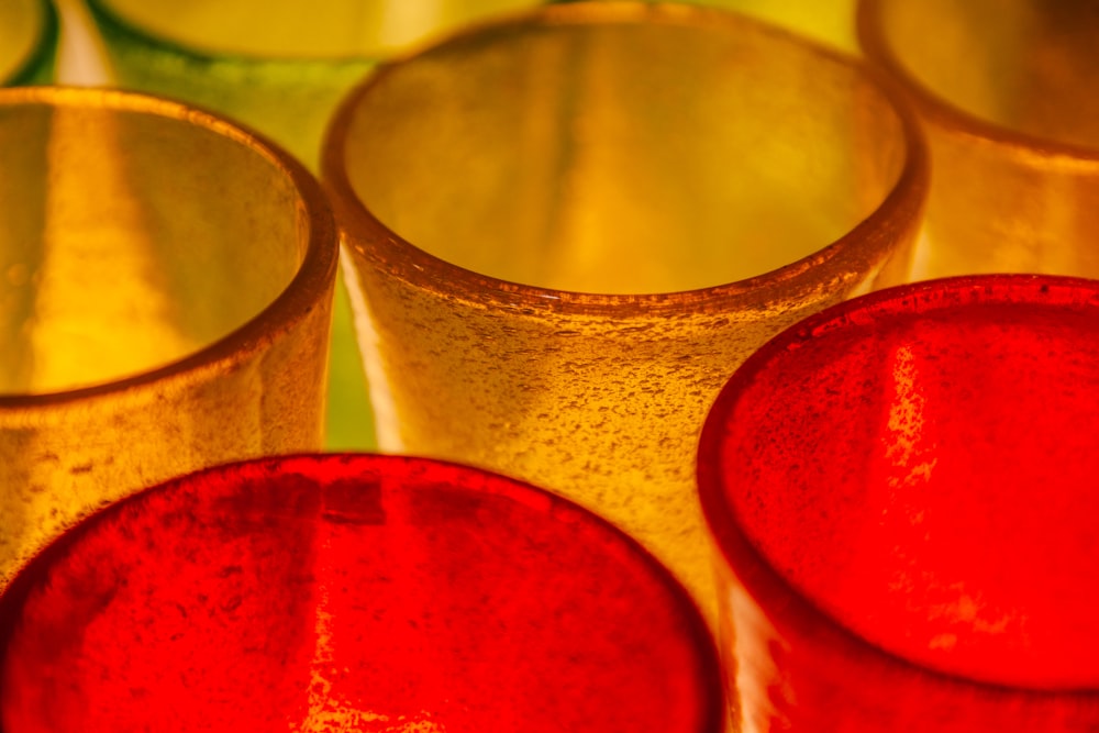 a group of red and gold cups sitting next to each other