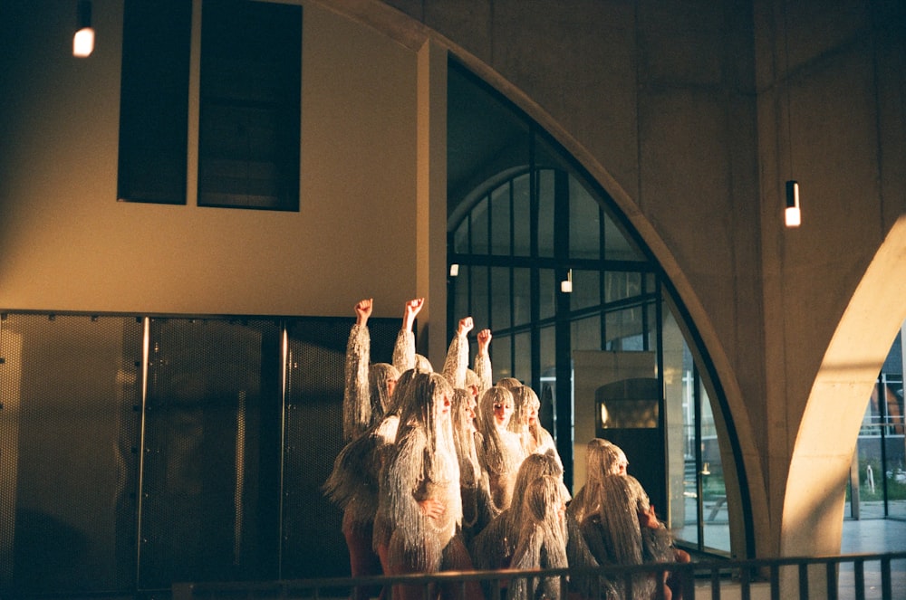 a group of women standing on top of a balcony