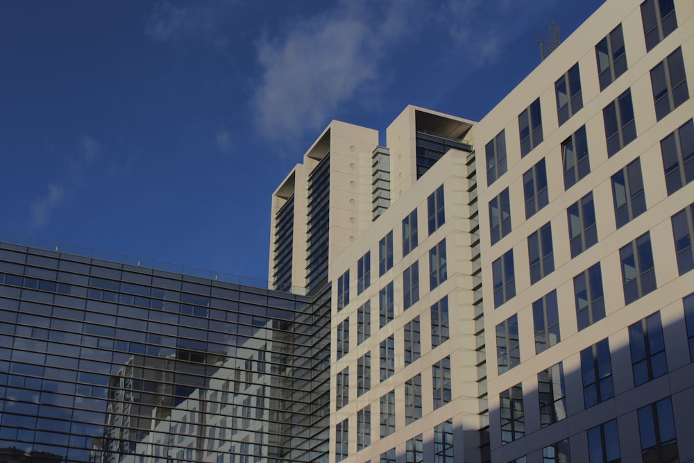 a large building with many windows and a sky background