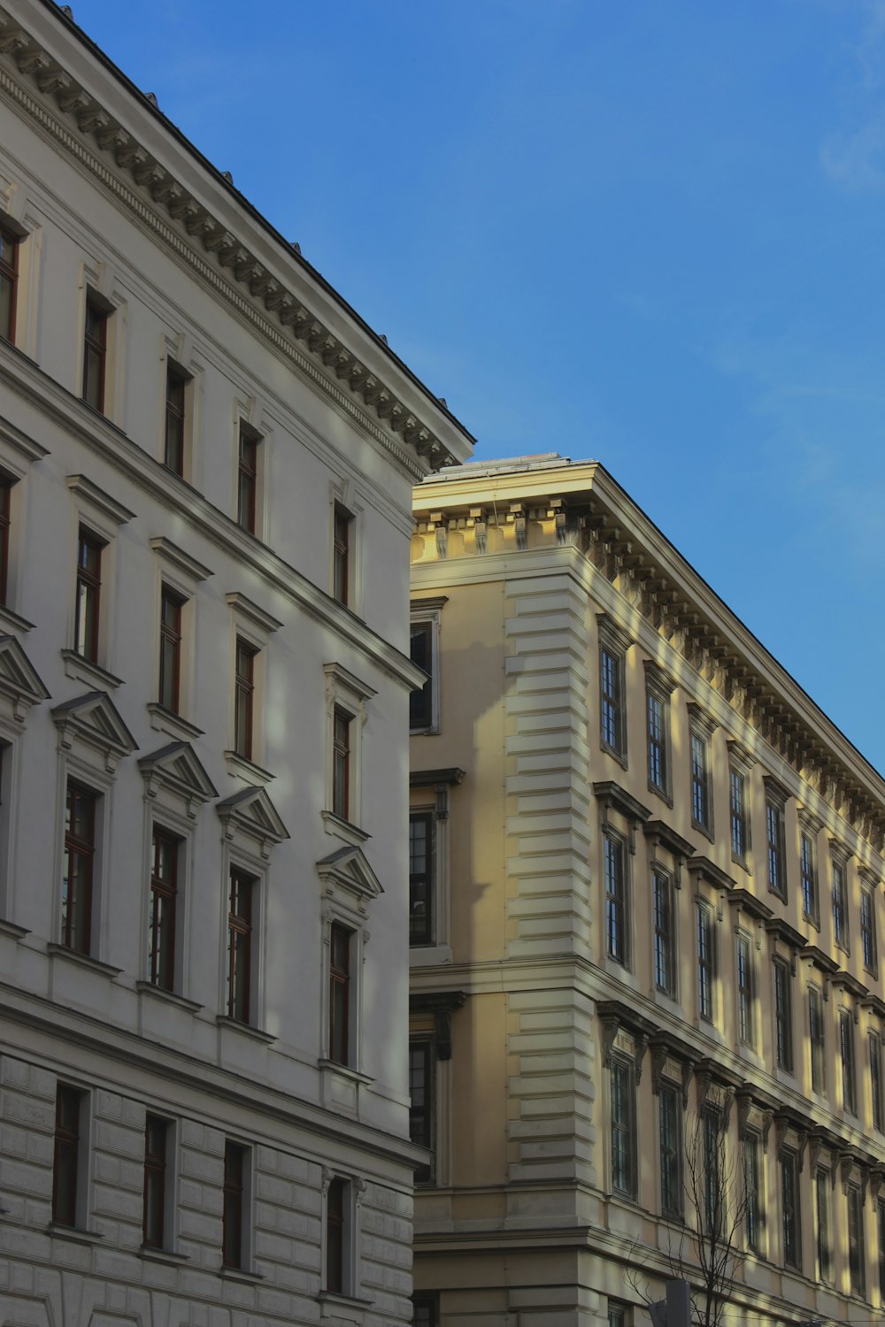 a clock on a pole in front of a building