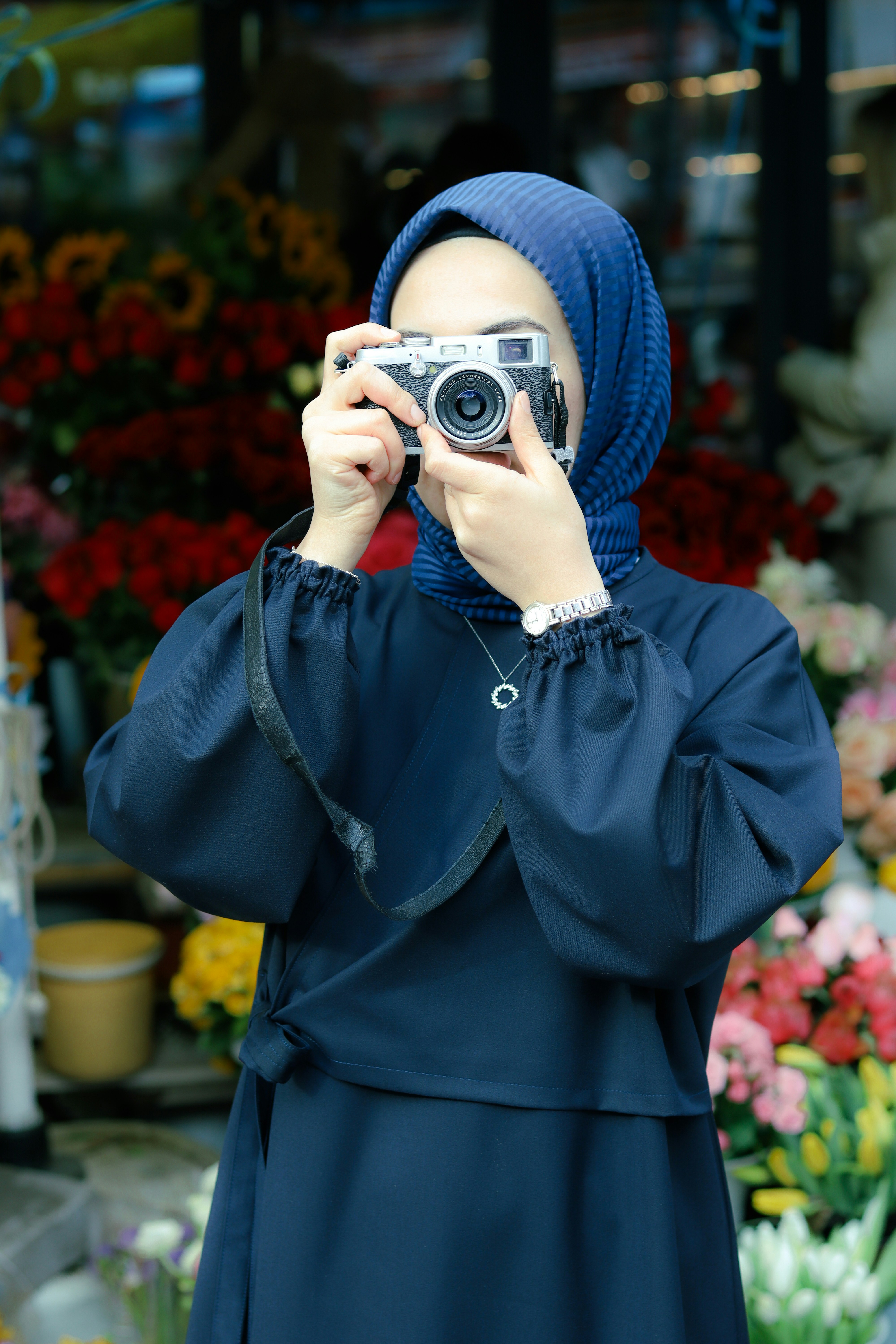 a woman taking a picture with a camera